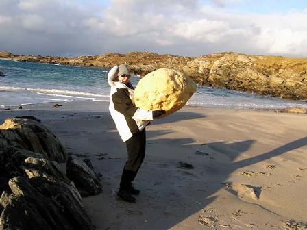 Superwoman lifting boulders